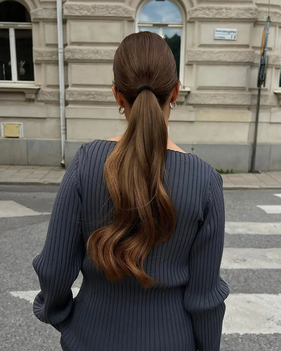 Sleek Mid-Back Ponytail With Wavy Ends Sleek Mid-Back Ponytail With Wavy Ends — Hairstyles 2027 for College
