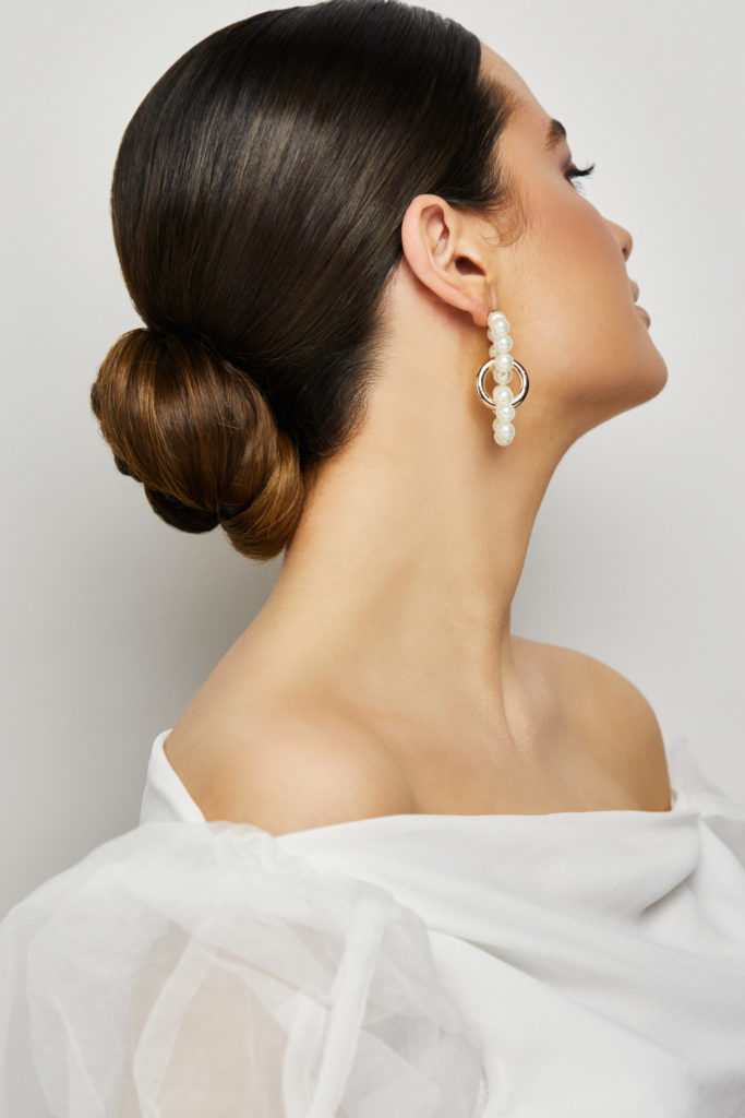 Low Sleek Dark Brown Bun From Side Low Sleek Dark Brown Bun From Side — Sleek Bun 2027