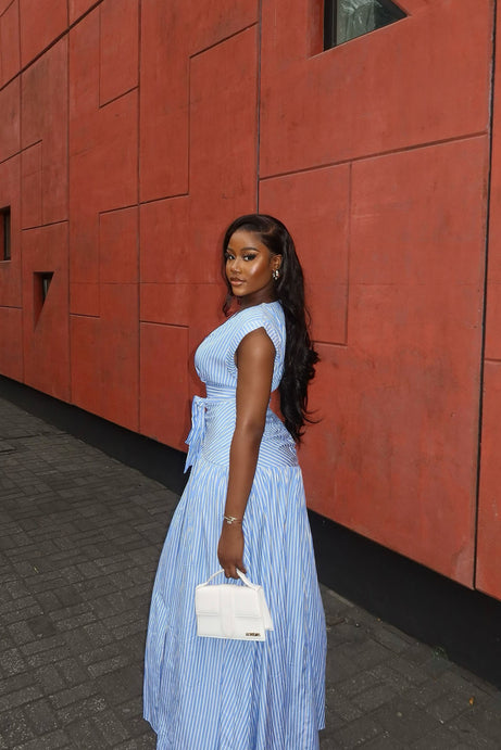 Chic Blue and White Striped Maxi Dress with Structured Handbag Chic Blue and White Striped Maxi Dress with Structured Handbag — Striped Dresses 2027