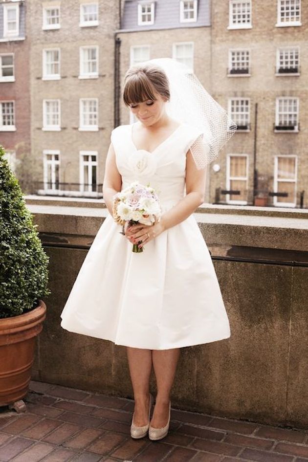 Dark Brown High Bun With Blunt Bangs — This Image Shows A Woman With Thick Dark Brown High Bun With Blunt Bangs — This Image Shows A Woman With Thick — Wedding Bangs 2027