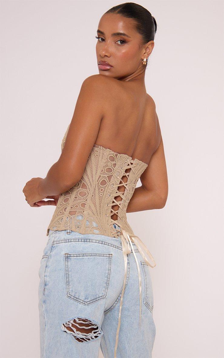 Beige Lace Bandeau Corset with Ripped Jeans Beige Lace Bandeau Corset with Ripped Jeans — Lace Corset Top Outfits 2027