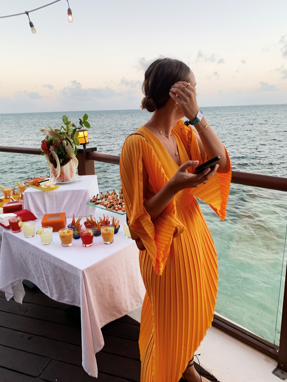 Bold Graphic Print Wrap Dress with Knee-High Boots — Cancun Outfits 2027