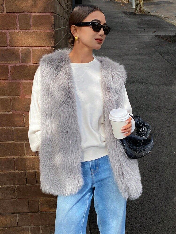 Grey Faux Fur Vest Over White Sweatshirt and Jeans — Winter Minimalist Outfits 2027