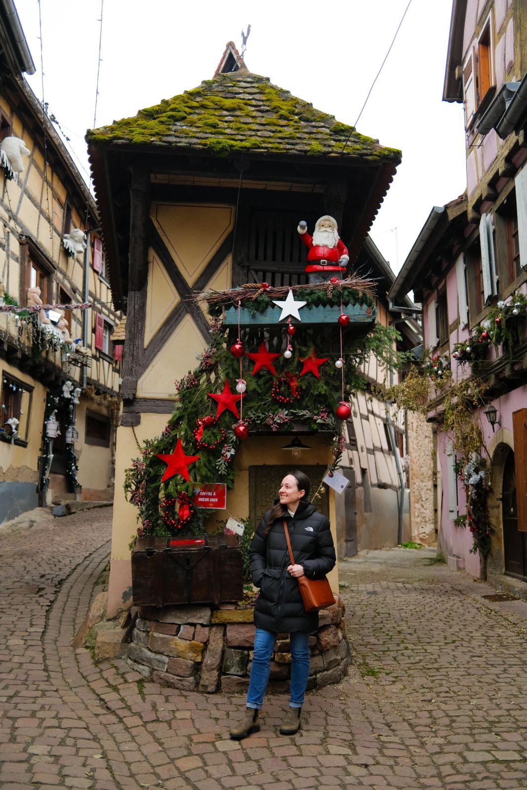 Black Puffer Jacket and Blue Jeans for a Casual Market Stroll — Christmas Market Outfits 2026