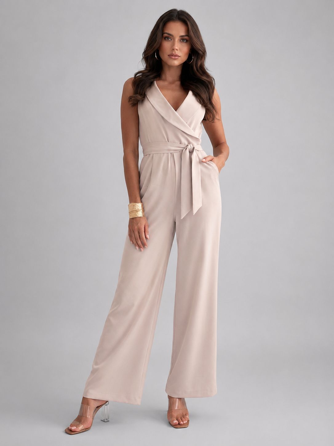 Beige Wrap V-Neck Jumpsuit with Clear Heels for Daytime Casual Beige Wrap V-Neck Jumpsuit with Clear Heels for Daytime Casual — Sleeveless Jumpsuit Outfits 2027