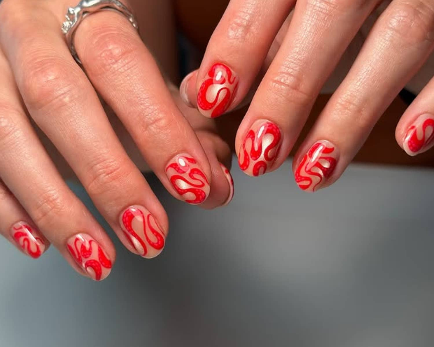 Red Swirls On Clear Base Visual Idea Red Swirls On Clear Base Visual Idea — Swirl Nails 2027