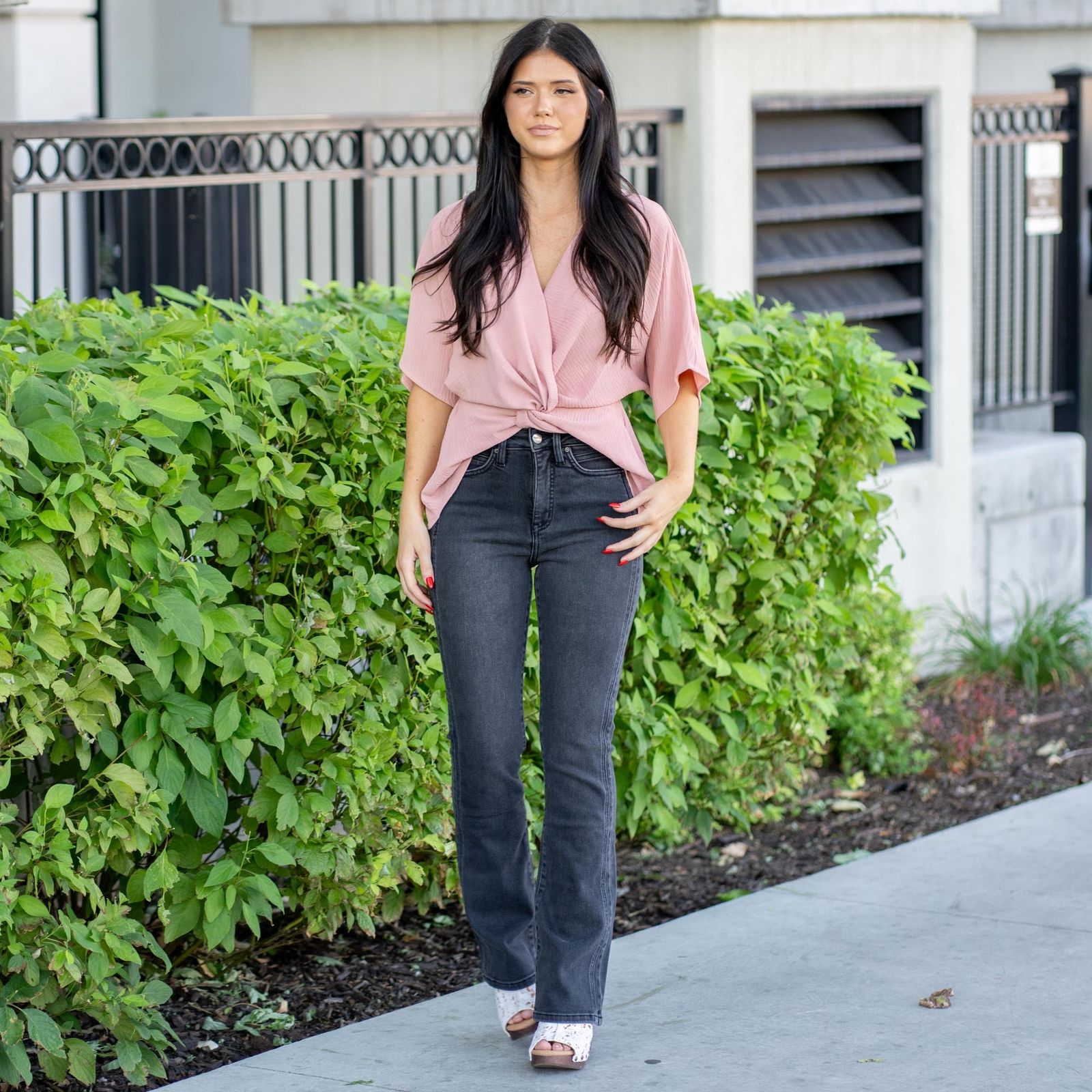 Slim Black Bootcut Jeans with Pink Wrap Top and Sandals — Black Bootcut Jeans Outfits 2027