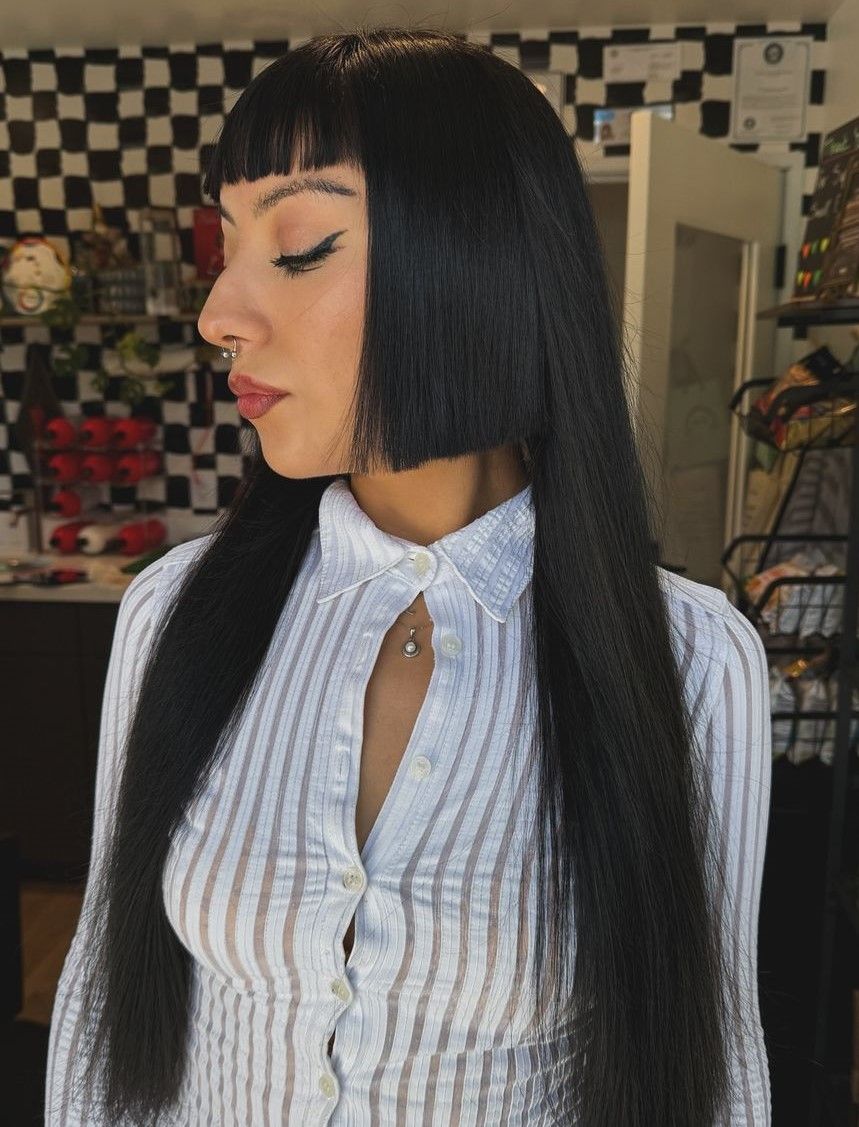 Sleek Black Collarbone Bob With Micro Bangs Sleek Black Collarbone Bob With Micro Bangs — Goth Hair Color 2027