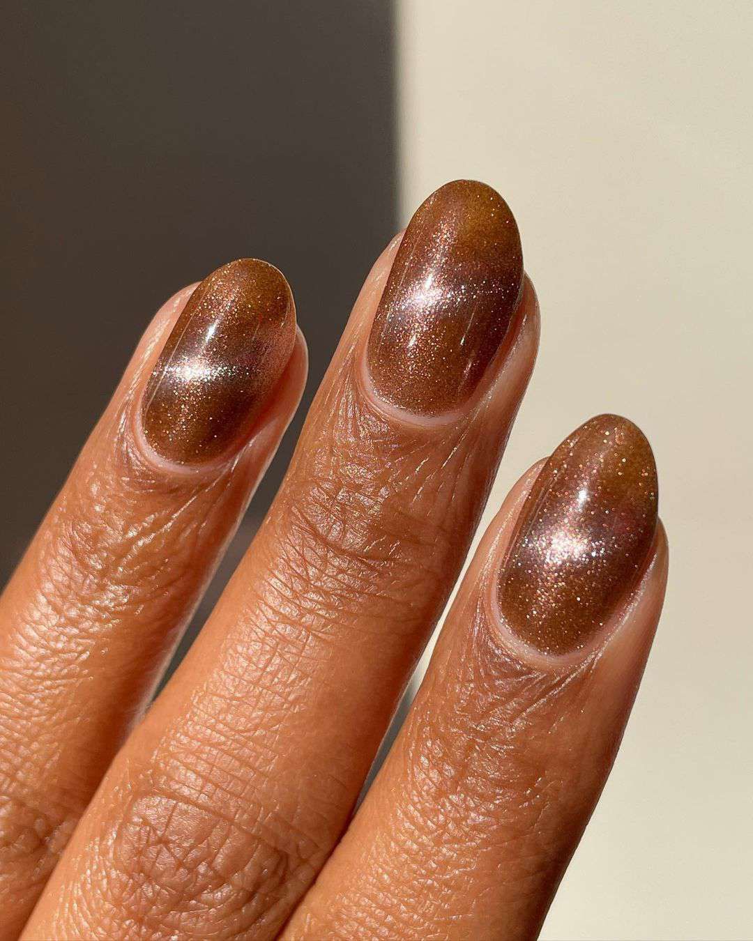 Shimmering Bronze-Brown Metallic Oval Nails Shimmering Bronze-Brown Metallic Oval Nails — Winter Nail Colors 2027 for Dark Skin