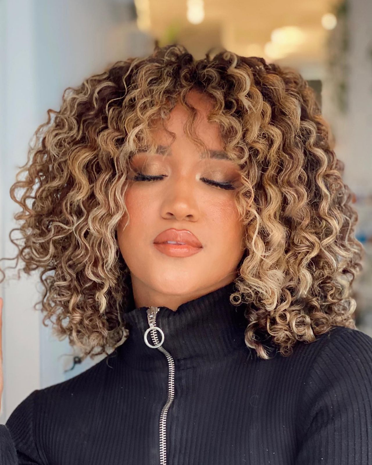 Chin-Length Curly Bob With Curtain Fringe Chin-Length Curly Bob With Curtain Fringe — Winter Haircuts 2027 for Round Faces
