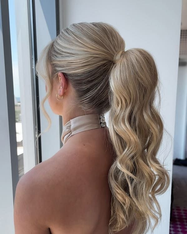 High Ponytail With Wavy Tail and Curtain Bangs High Ponytail With Wavy Tail and Curtain Bangs — Prom Hairstyles 2027 with Weave
