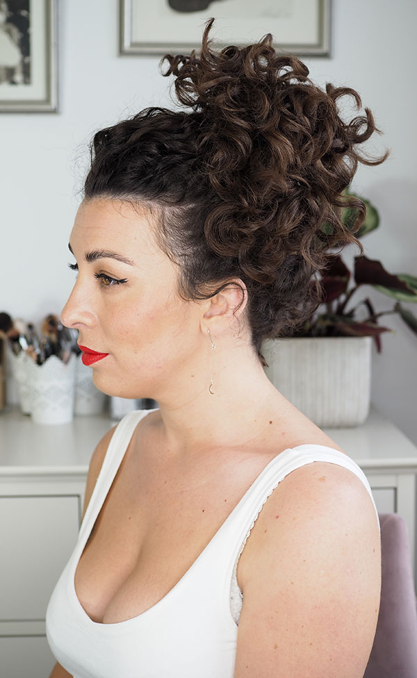 High Messy Bun With Loose Curls High Messy Bun With Loose Curls — Second Day Hairstyles 2027