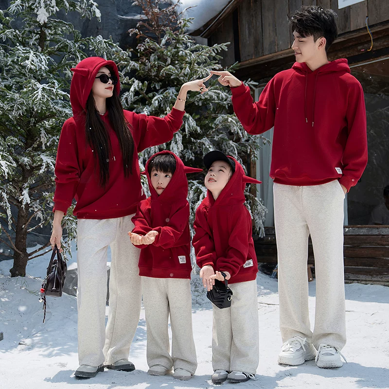 Red Hooded Sweatshirts And Grey Sweatpants Red Hooded Sweatshirts And Grey Sweatpants — Matching Family Christmas Outfits 2026