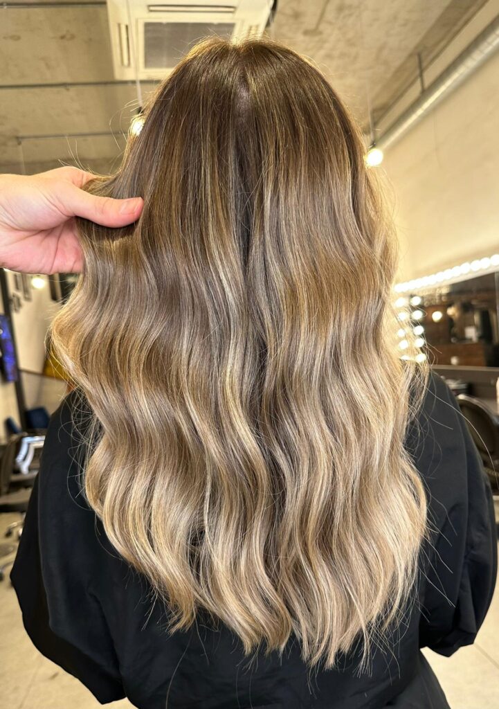 Loose Waves Mid-Back Dark Brown Seamless Blonde Loose Waves Mid-Back Dark Brown Seamless Blonde — Blonde Balayage 2027