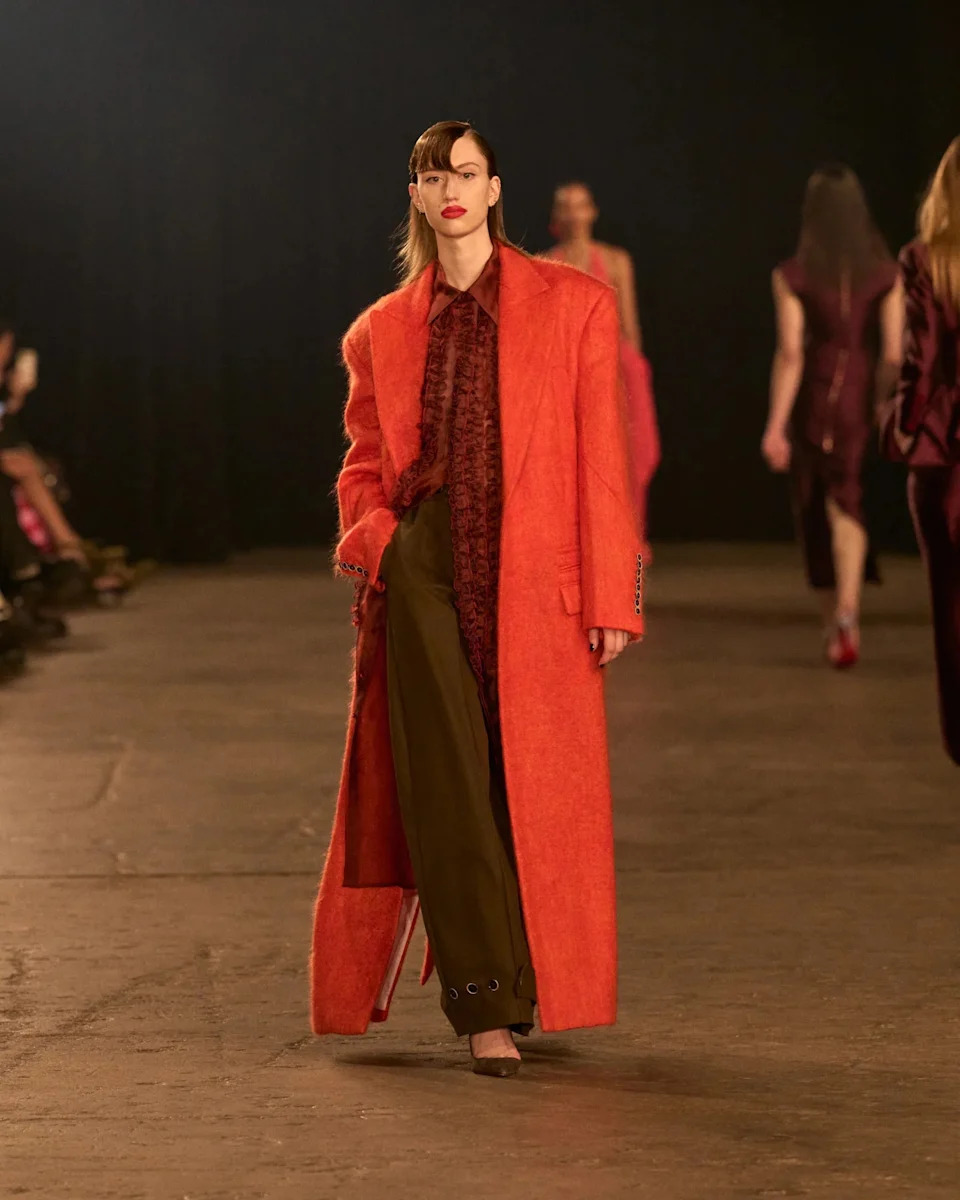 Bold Orange Textured Coat Over Patterned Shirt and Trousers — Outfit Trends 2027