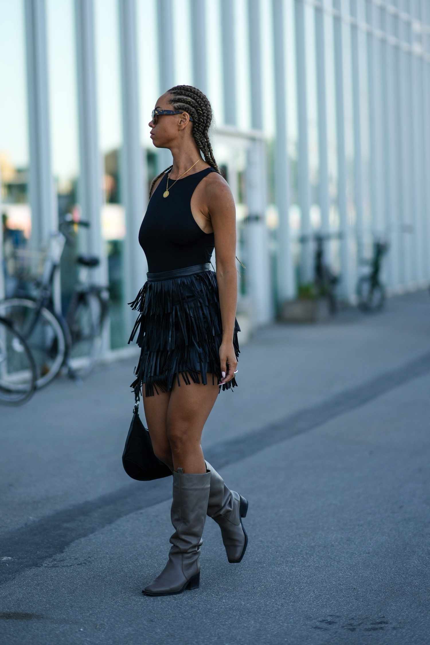 Edgy Night Out: Black Tank with Fringe Skirt and Knee-High Boots — Tank Top Outfits 2027