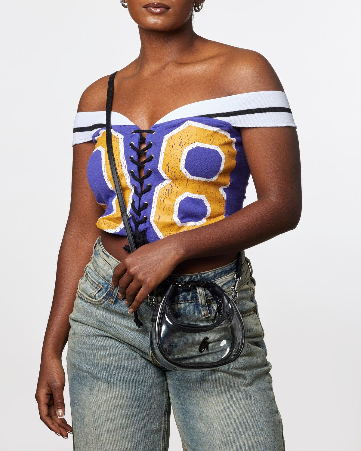 Sports Graphic Top and Jeans with a Mini Clear PVC Bag — Clear Bag Outfits 2027