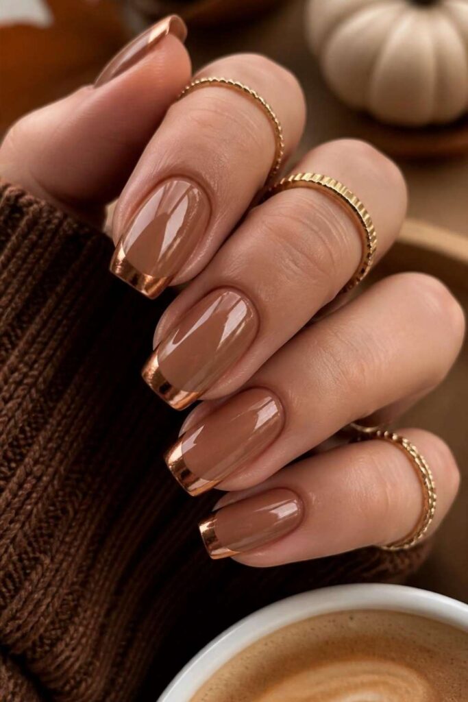 Glossy Nude Brown Gold French Tip Glossy Nude Brown Gold French Tip — Medium Length Winter Nails 2027