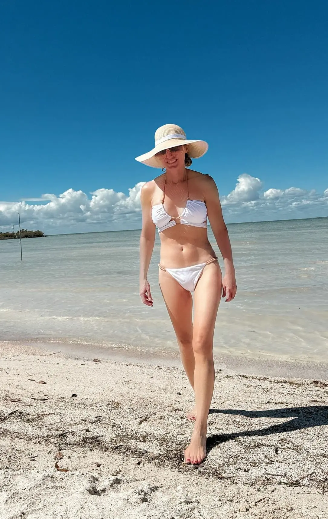 White Bikini with Gold Chain Detail — Spring Break Beach Outfits 2027