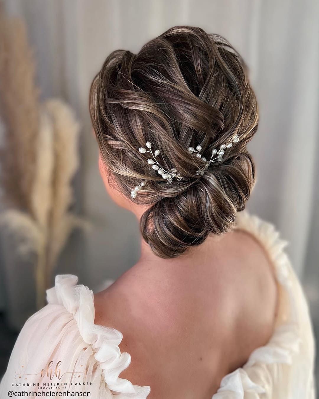 Mid-Back Dark Brown Textured Bun with Pearls Mid-Back Dark Brown Textured Bun with Pearls — Side Bun Hairstyles 2027