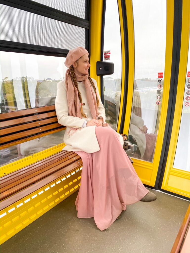 Cream Coat with Pink Scarf and Beret — Disney Winter Outfits 2027