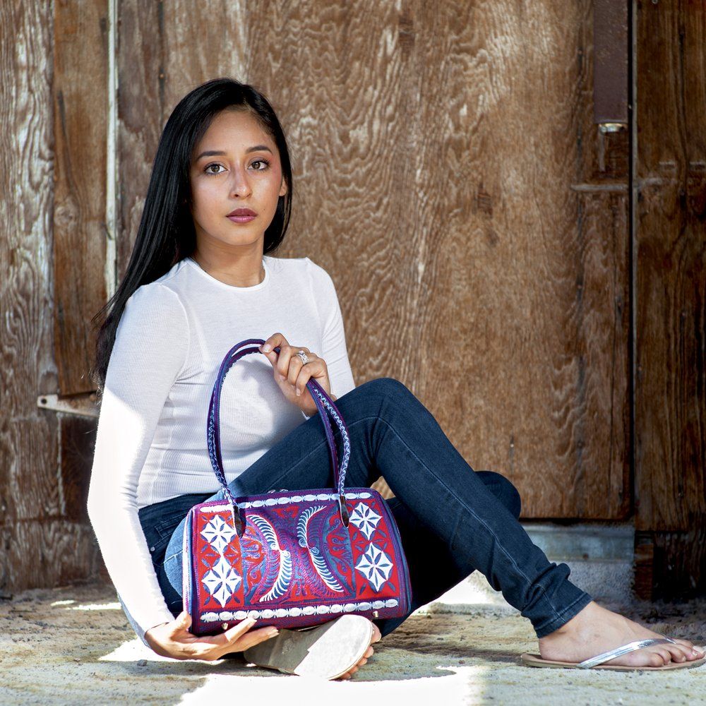 Embroidered Handbag Elevates Casual White Top and Jeans Embroidered Handbag Elevates Casual White Top and Jeans — Huntington Beach Outfits 2027
