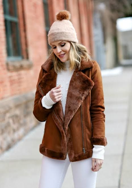 Shearling Jacket Over Knit Sweater with White Pants — Layered Winter Outfits 2027