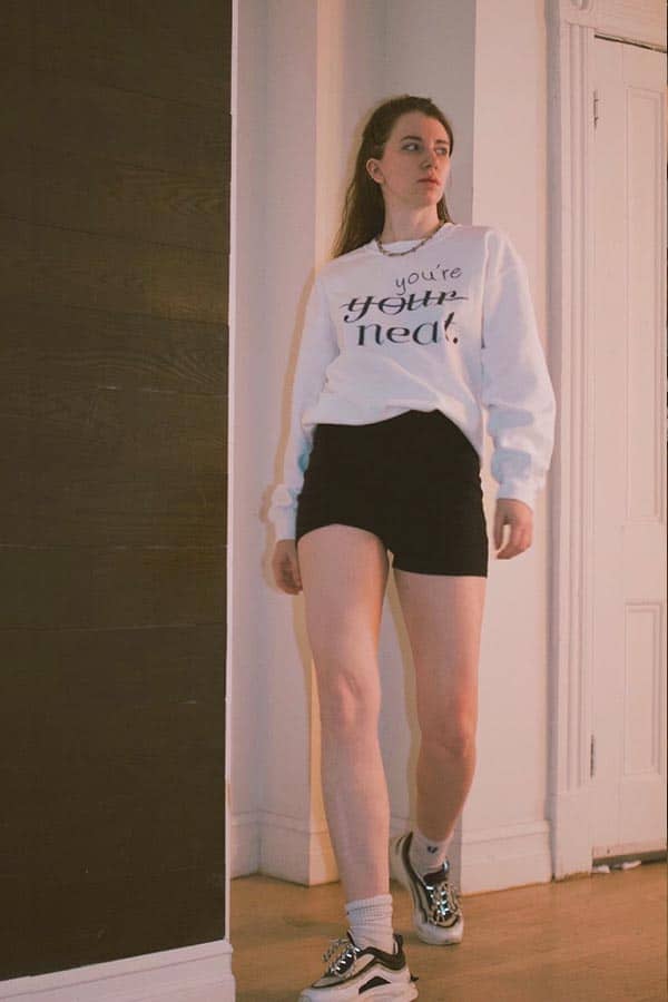 Graphic Pop: White Sweatshirt with Black Shorts Graphic Pop: White Sweatshirt with Black Shorts — Sweatshirt Outfits 2027