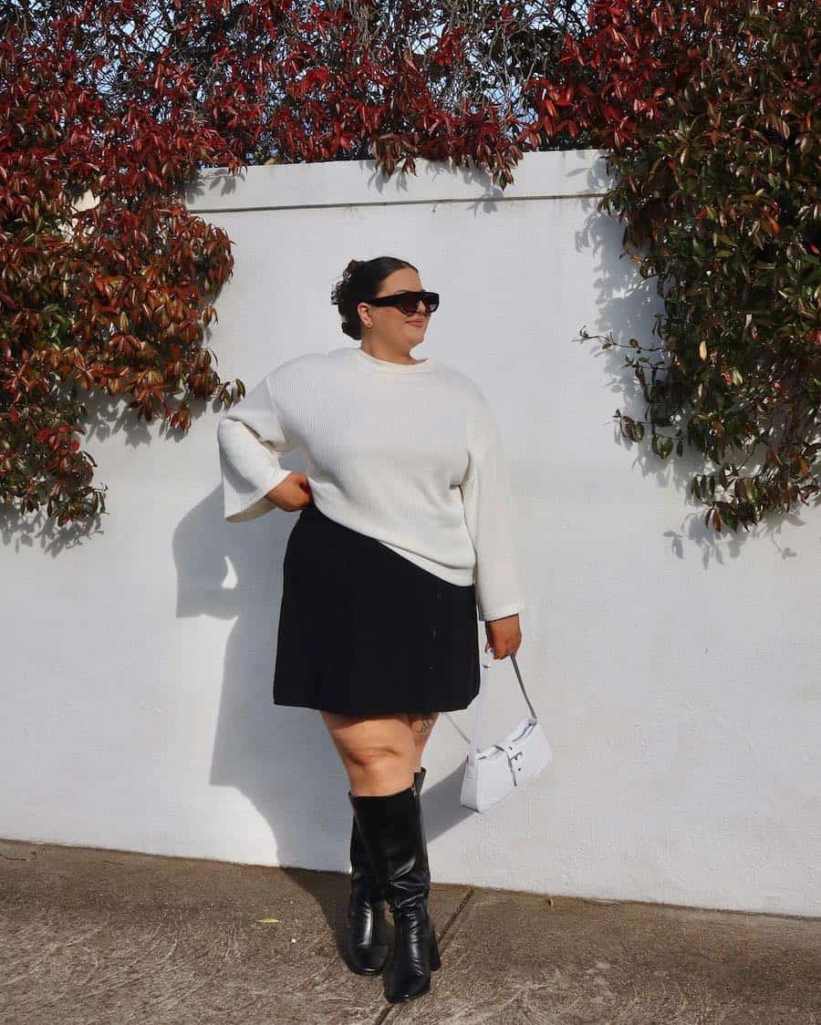 Oversized Knit Sweater with Mini Skirt and Boots — Plus Size Thanksgiving Outfits 2026
