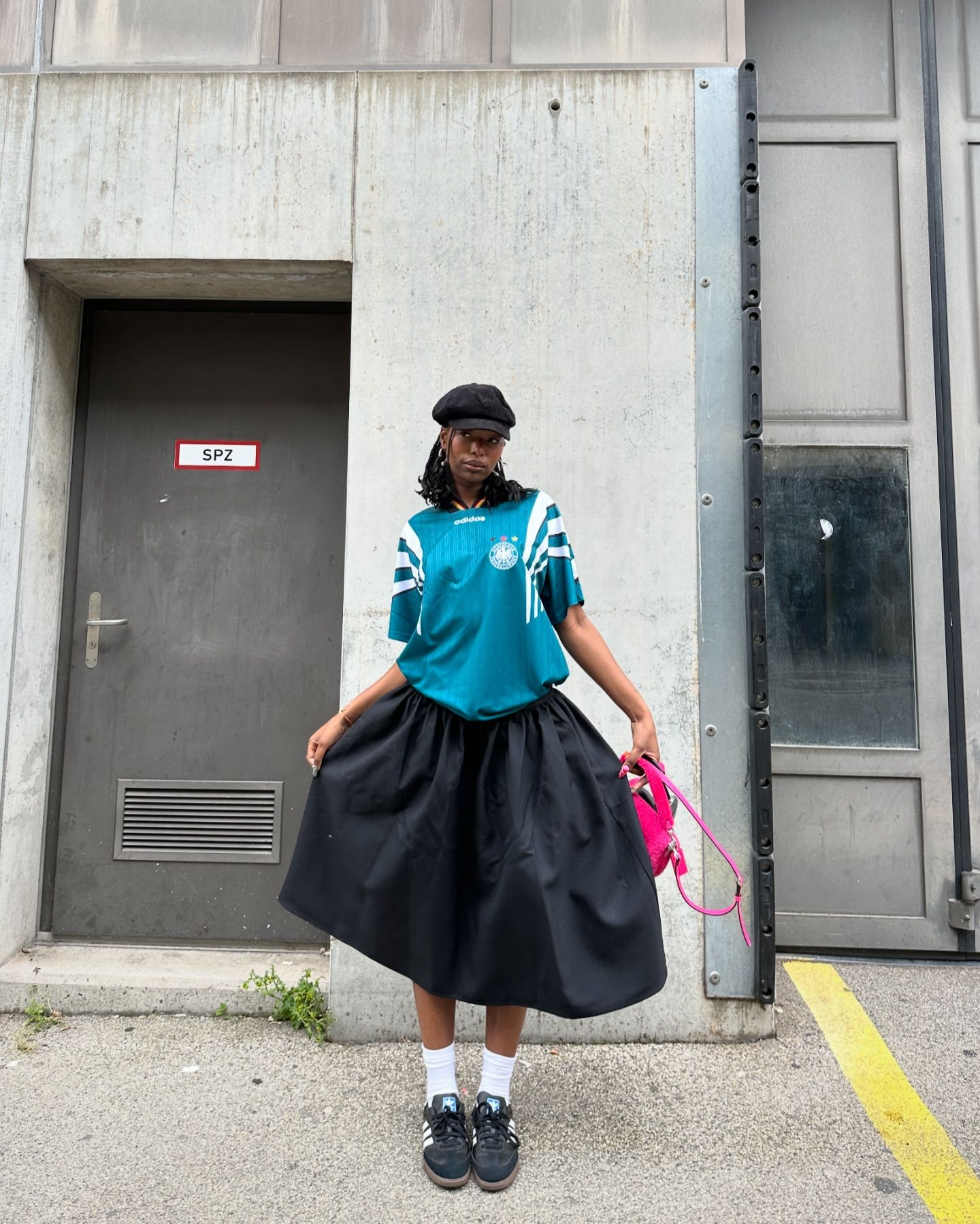 Sporty Feminine: Black Adidas Samba with Full Skirt and Pink Backpack Sporty Feminine: Black Adidas Samba with Full Skirt and Pink Backpack — Adidas Samba Outfits 2027