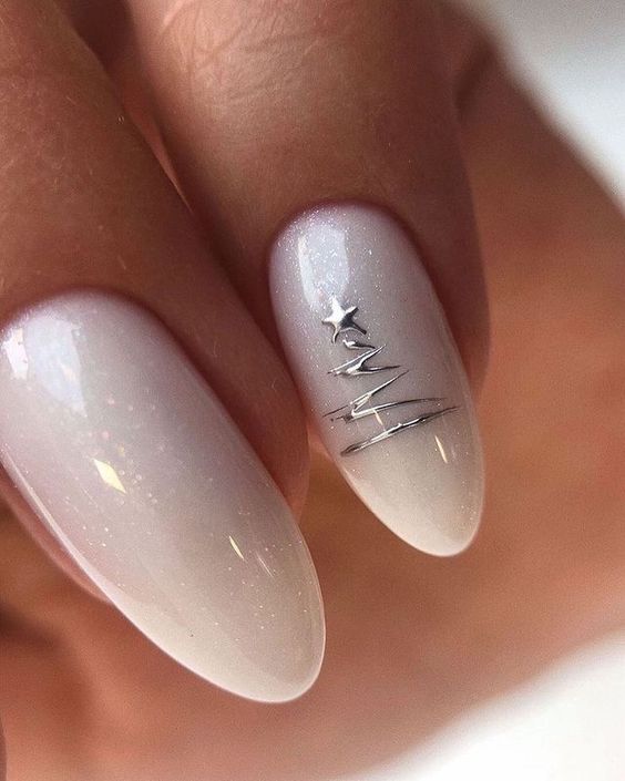 Off-White Silver Tree Outline Almond Nails Off-White Silver Tree Outline Almond Nails — Neutral Christmas Nails 2026