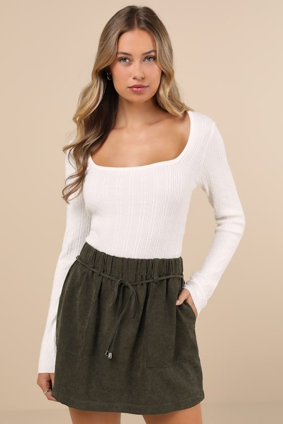 Fitted Olive Green Corduroy Mini Skirt with Drawstring Waist and White Top Fitted Olive Green Corduroy Mini Skirt with Drawstring Waist and White Top — Olive Green Mini Skirt Outfits 2027