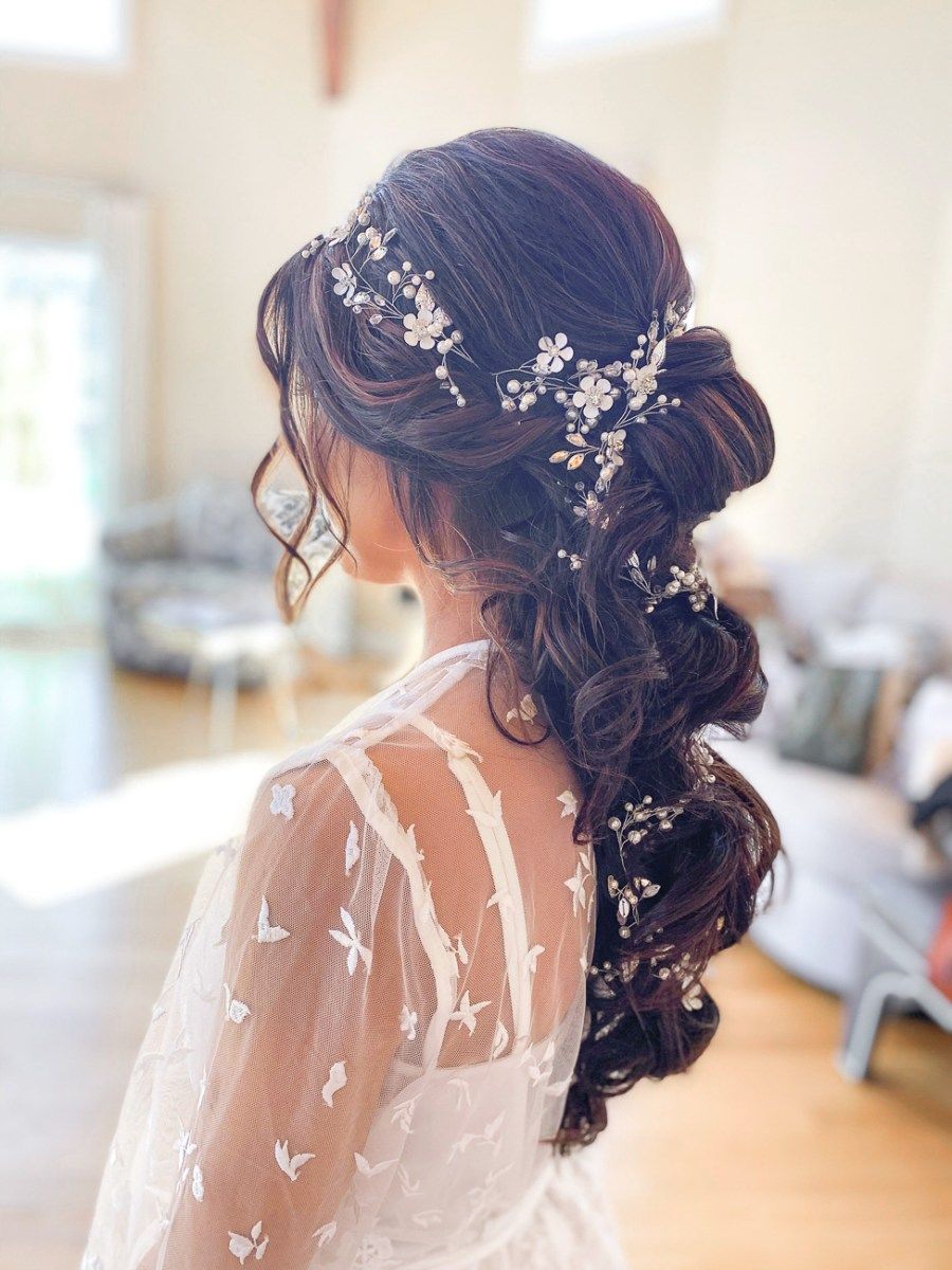 Loose Dark Brown Updo With Florals Loose Dark Brown Updo With Florals — Church Wedding Hairstyles 2027