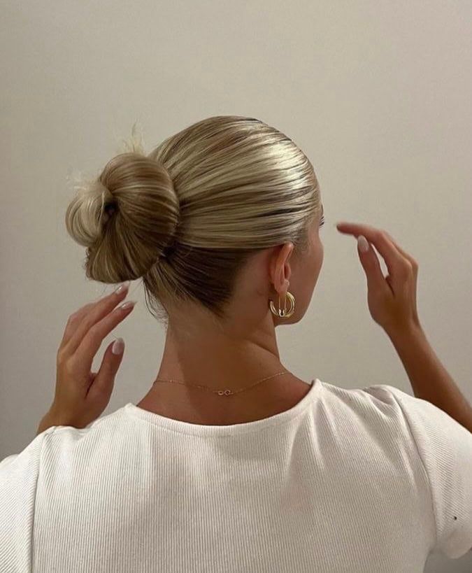 Sleek High Bun With Blonde Highlights Sleek High Bun With Blonde Highlights — Summer Updos 2027