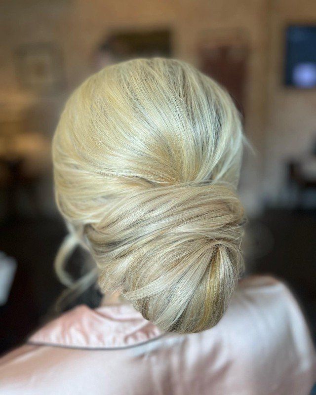 Smooth Twisted Low Bun With Ash Blonde Highlights Smooth Twisted Low Bun With Ash Blonde Highlights — Engagement Party Hairstyles 2027