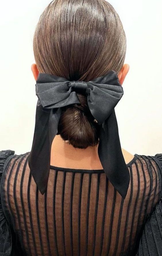 Sleek Low Bun With Large Black Bow — Big Bow Hairstyles 2027