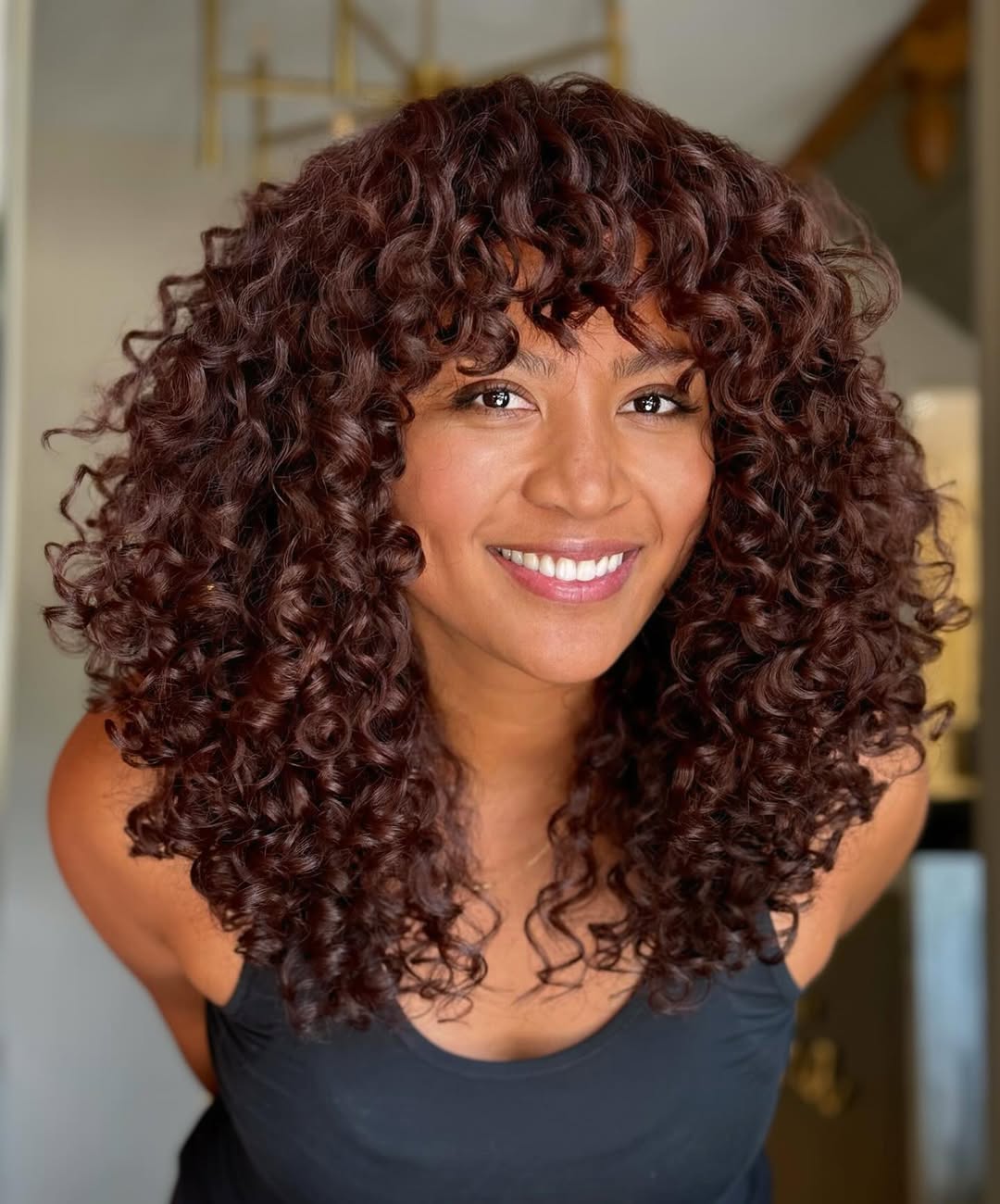 Layers Collarbone Dark Auburn With Highlights Layers Collarbone Dark Auburn With Highlights — Hair Color 2027 for Curly Hair