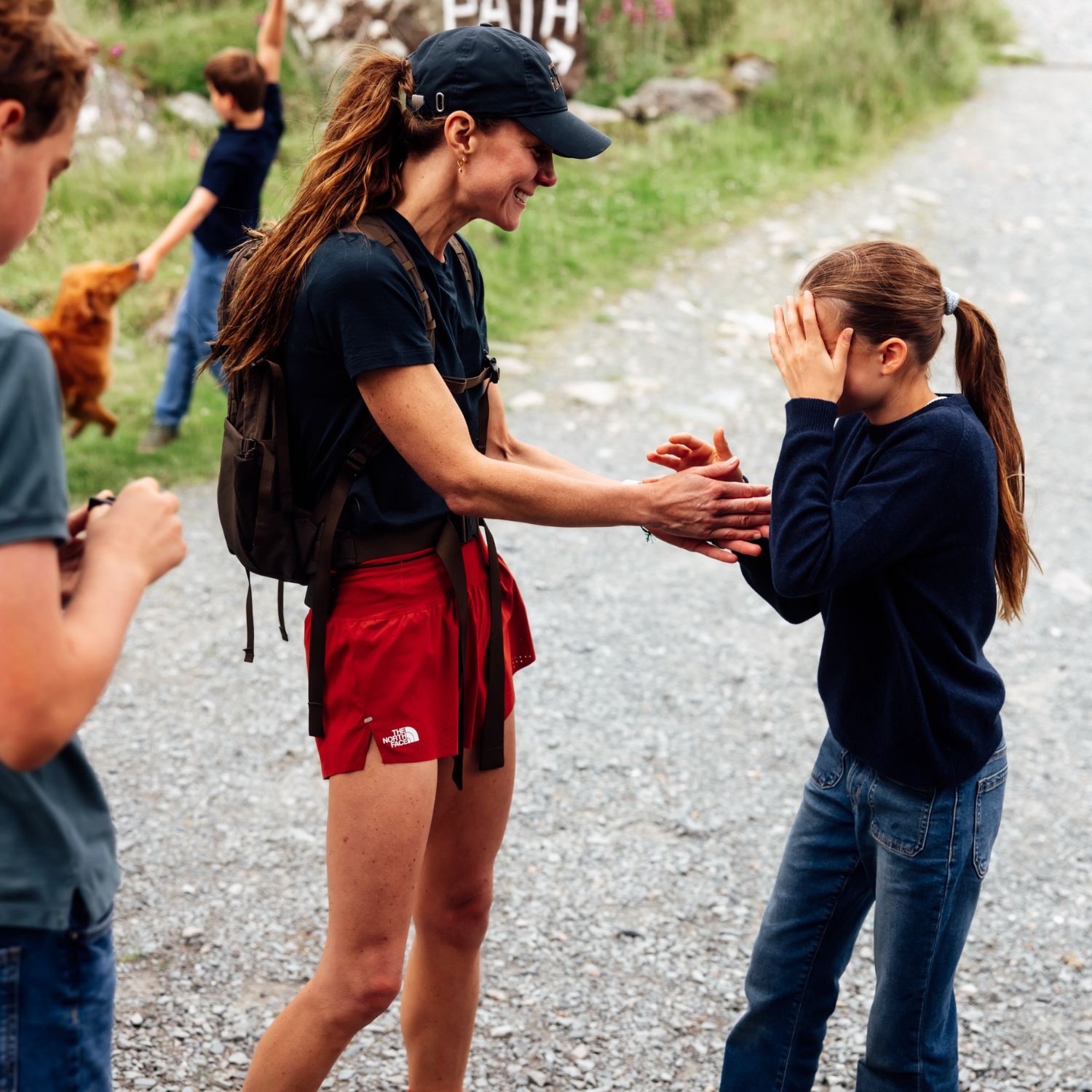 Red Athletic Shorts with Navy T-Shirt and Backpack — Athletic Hiking Outfits 2027