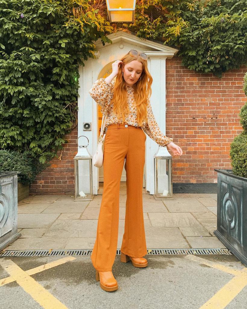 Brown Flared Trousers Paired with a Floral Print Blouse — Mustard Outfits 2027
