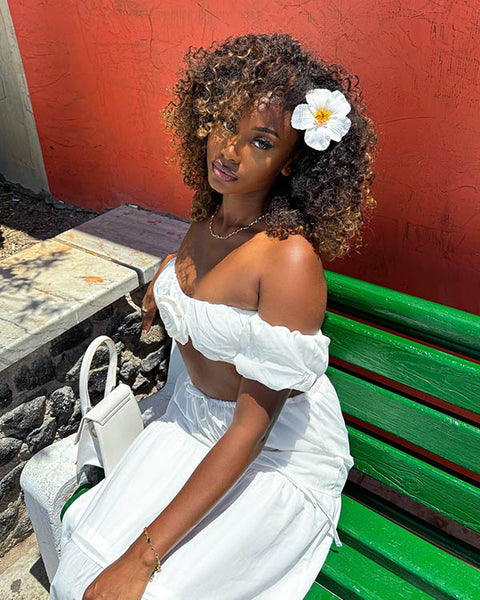 Shoulder Length Waves With Flower — Vacation Hairstyles 2027