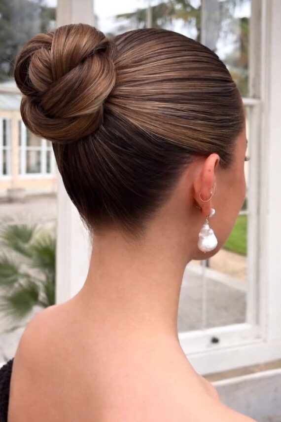 Voluminous Dark Brown Bun With Highlights Voluminous Dark Brown Bun With Highlights — Sleek Bun 2027
