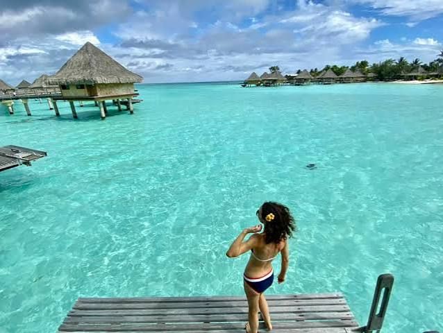 Tropical Bliss: Bikini with Flower in Hair Tropical Bliss: Bikini with Flower in Hair — Bora Bora Outfits 2027
