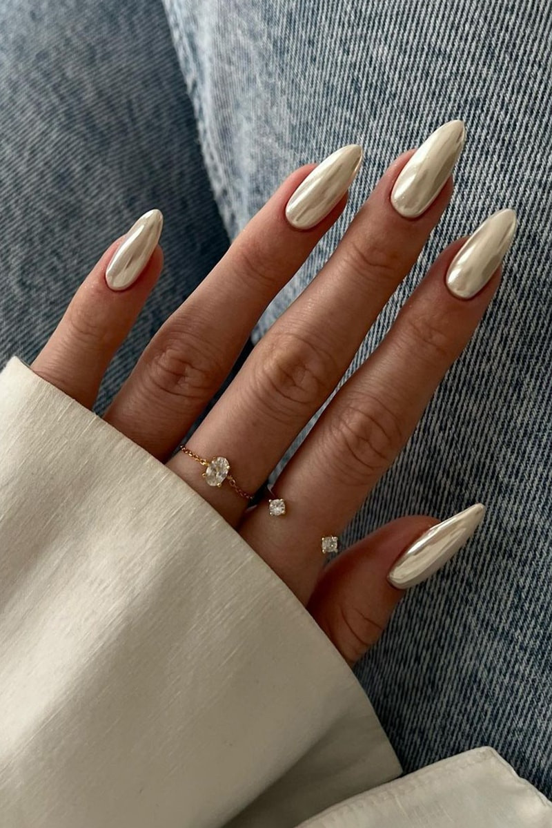 One Hand Close-Up Pale Beige Pearlescent Chrome Medium Almond One Hand Close-Up Pale Beige Pearlescent Chrome Medium Almond — Glazed Nails 2027