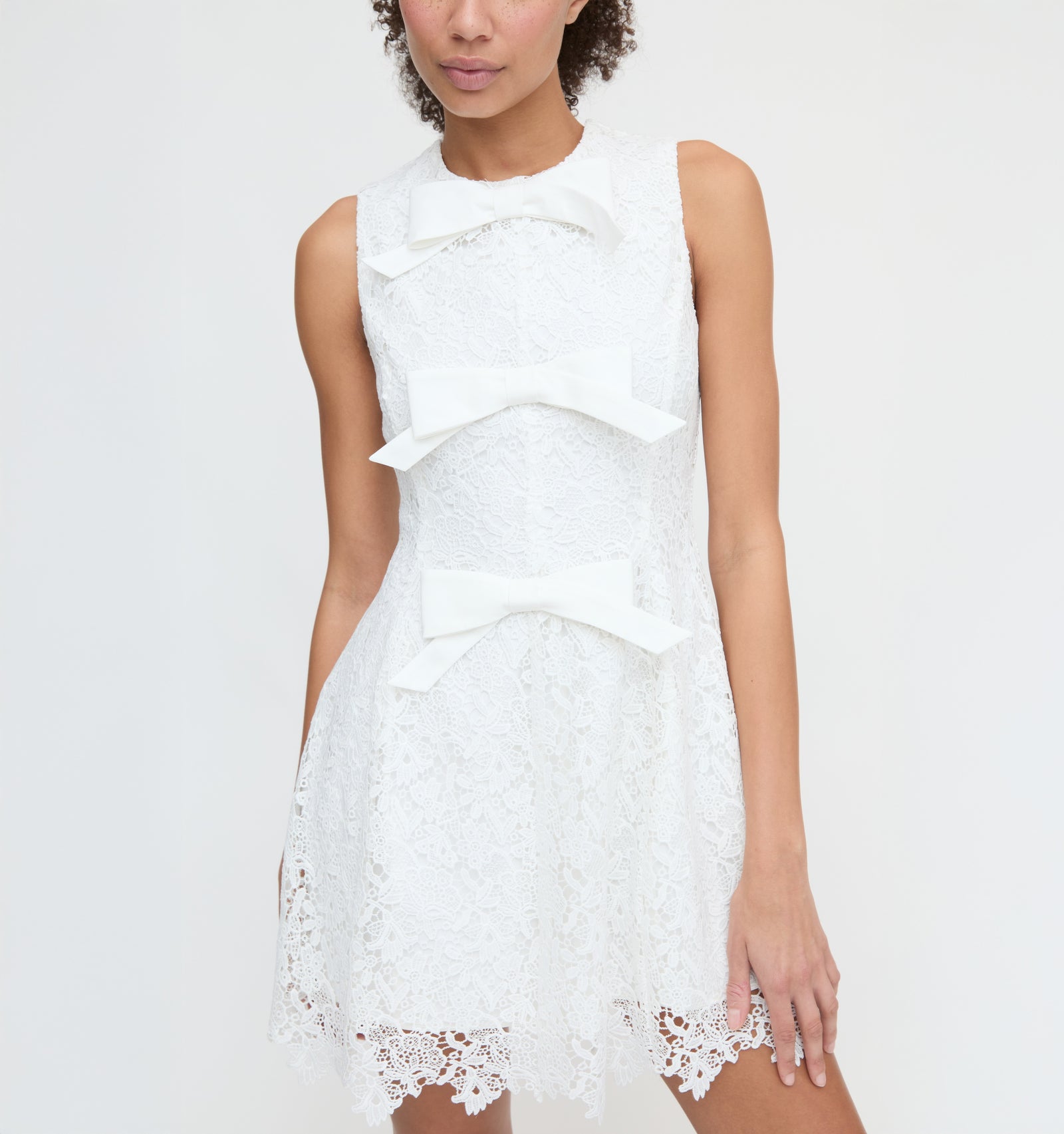 White Lace Mini Dress with Multiple Bow Details White Lace Mini Dress with Multiple Bow Details — Bows and Lace Outfits 2027