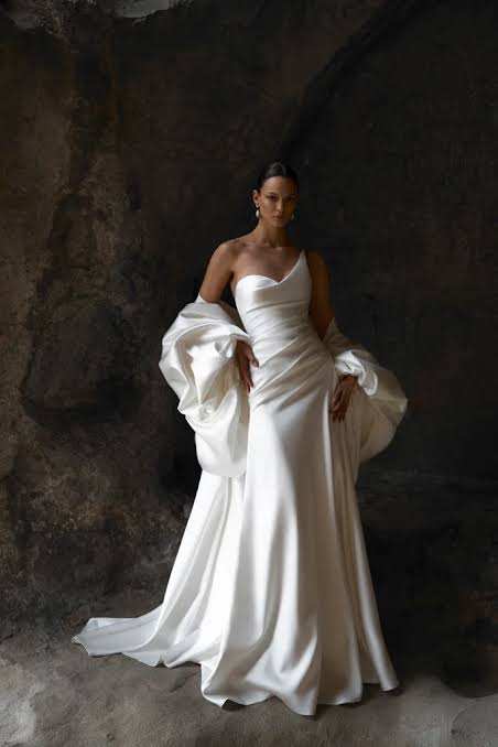 Sculptural Statement: One-Shoulder Gown with Draped Sleeves — Wedding Dress Trends 2027