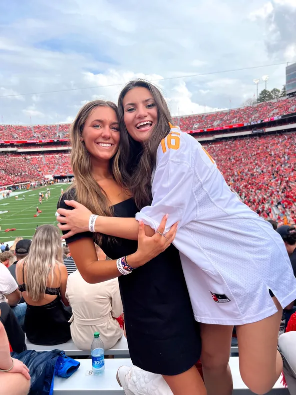 Jersey Layering: Oversized Jersey Over Mini Dress — College Game Day Outfits 2026