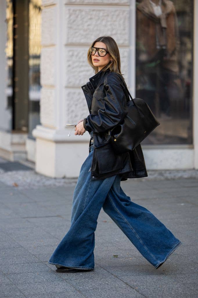 Wide-Leg Blue Jeans Accompanied by a Black Leather Jacket and Brown Loafers Wide-Leg Blue Jeans Accompanied by a Black Leather Jacket and Brown Loafers — Spring Outfits 2027 with Jeans