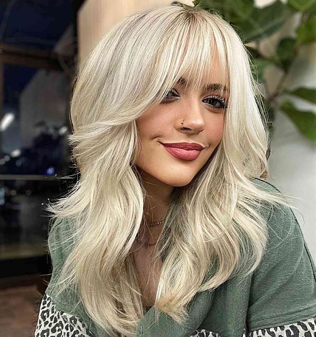 Collarbone Platinum Blonde Shag With Voluminous Bangs Collarbone Platinum Blonde Shag With Voluminous Bangs — Low Maintenance Bangs 2027