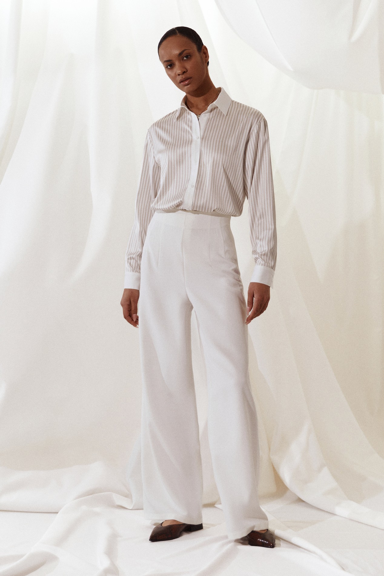 Striped Button-Down Shirt with High-Waisted Trousers Striped Button-Down Shirt with High-Waisted Trousers — Scandinavian Outfits 2027