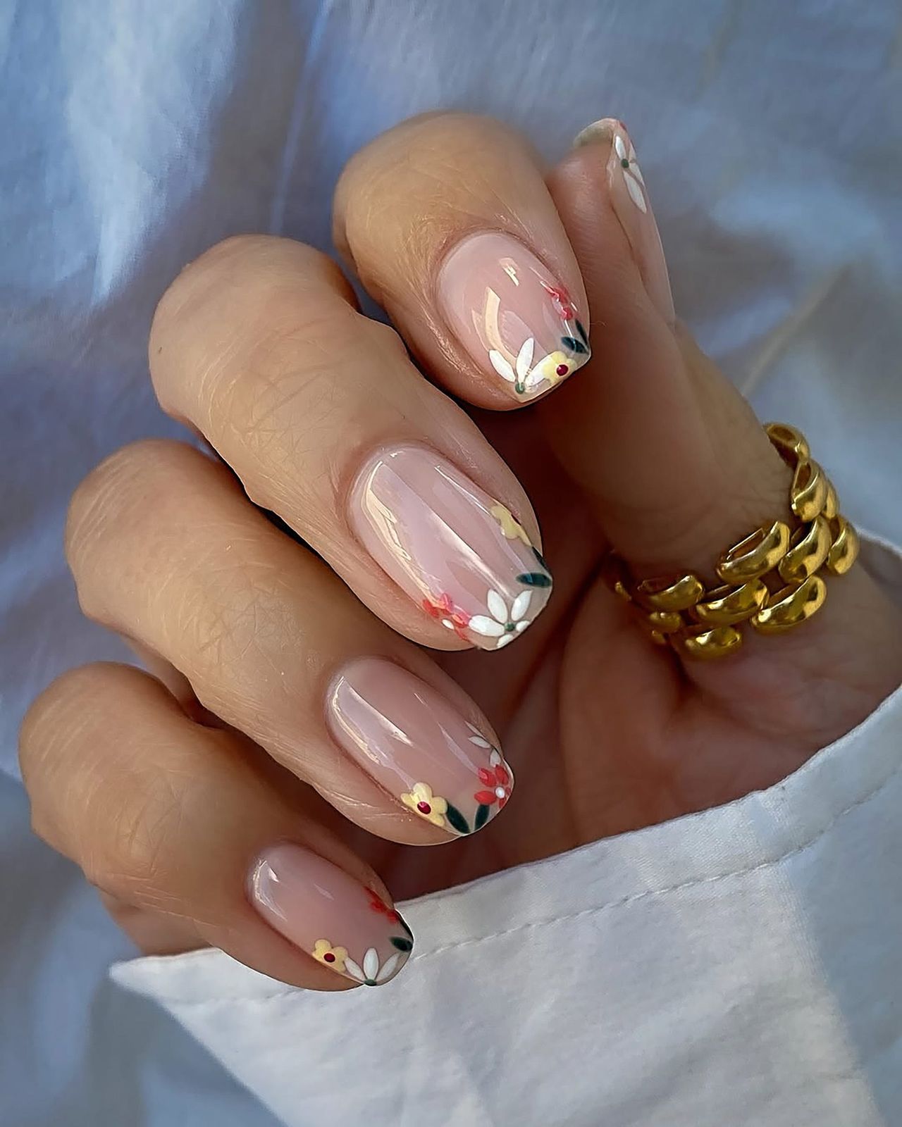 Glossy Floral French Tips on Nude Glossy Floral French Tips on Nude — Floral Round Nails 2027